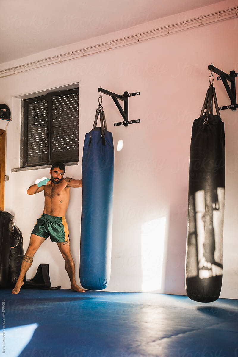 Male Kickboxing Athlete During A Bag-work Session