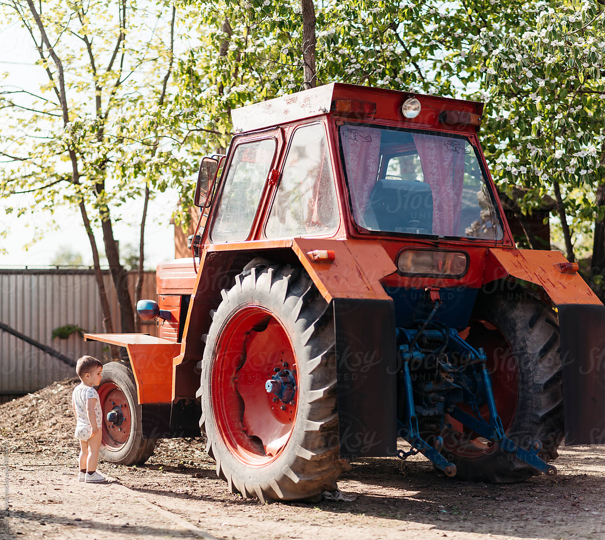 Toddler and tractor.
