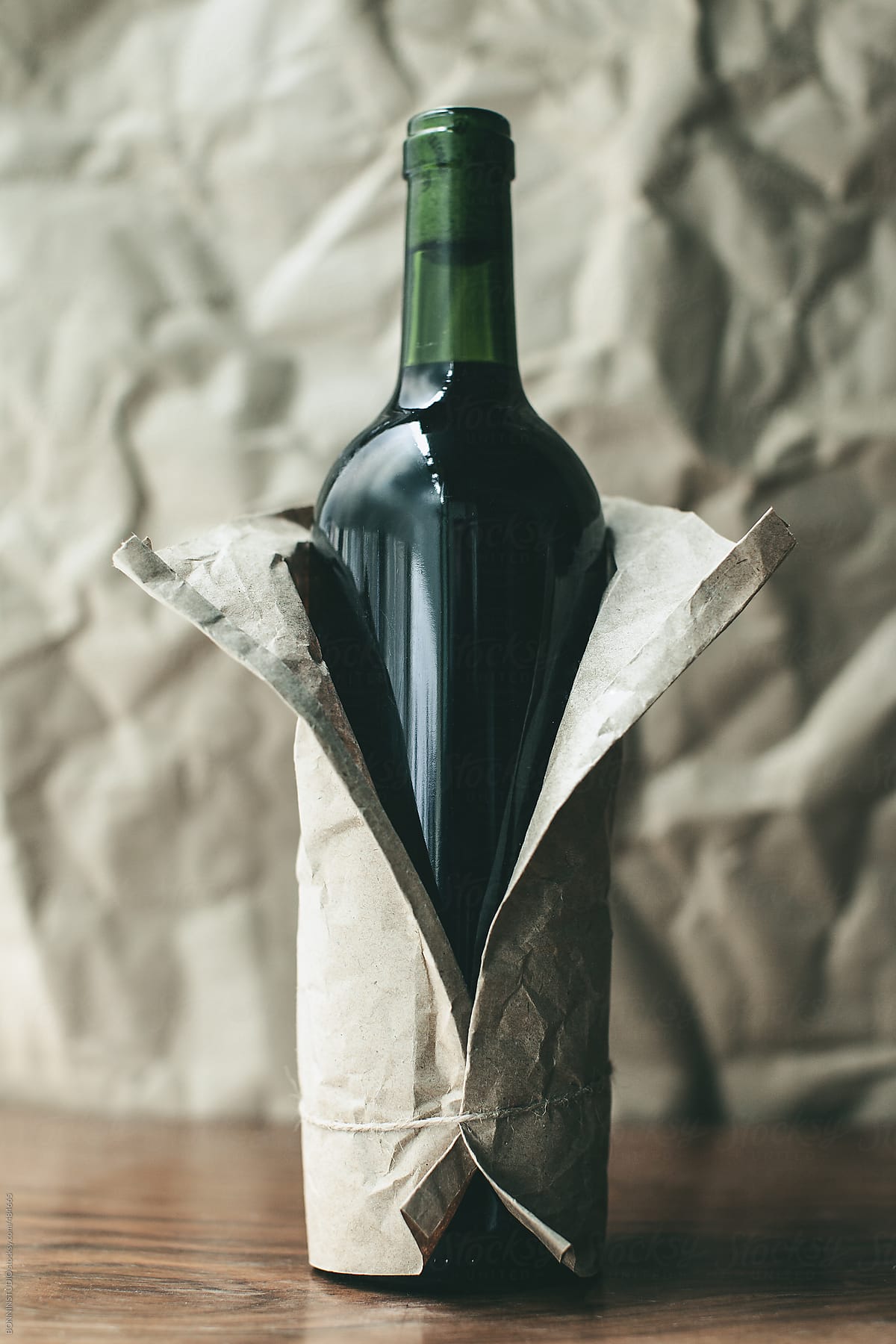 Wrapped red wine bottle.