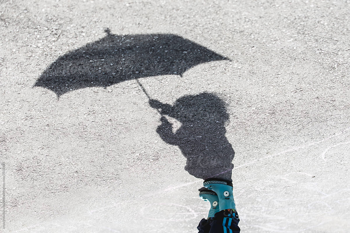 Shadow of a girl with an umbrella