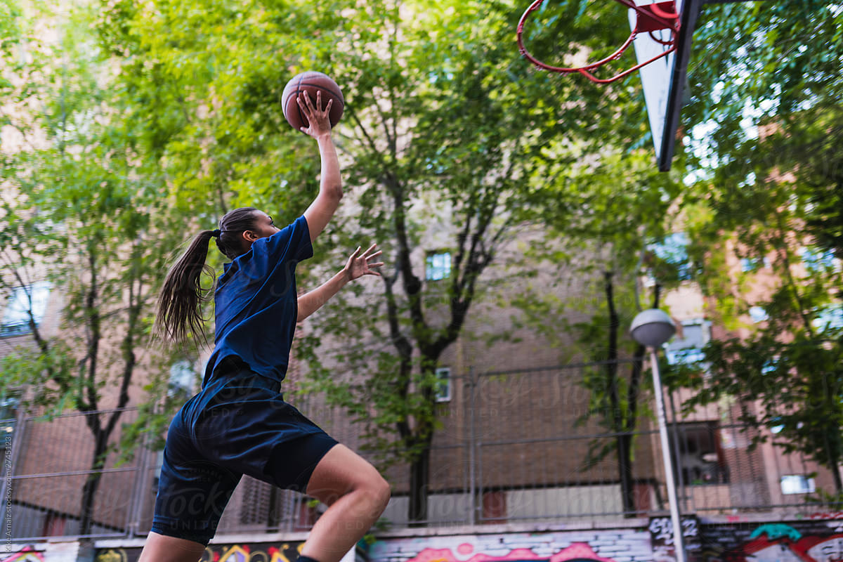 Female basketball player jumping