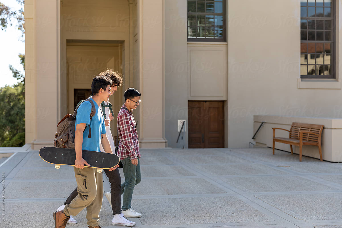 A Group of Men Walking on a Campus