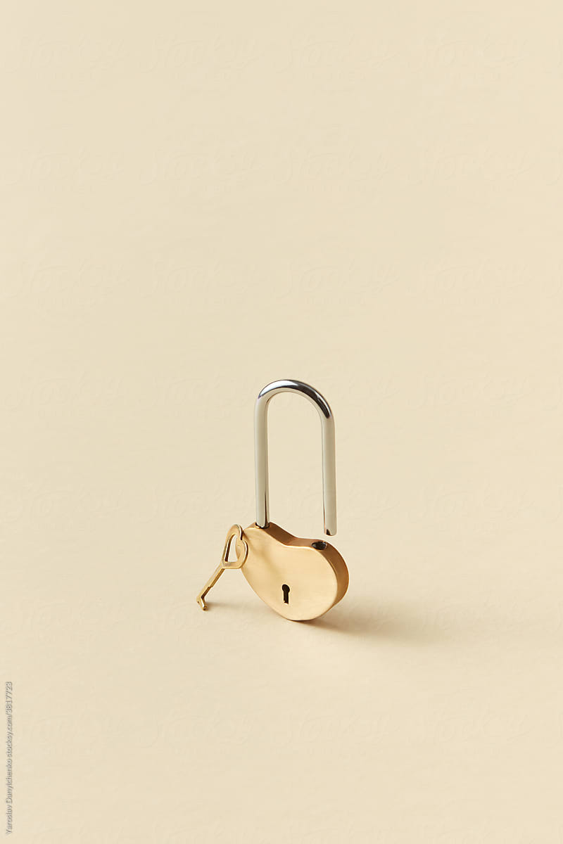 Heart shaped small golden padlock with key