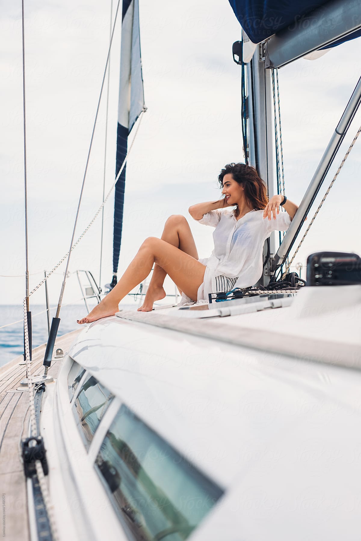 Woman Enjoying Summertime on Sailboat