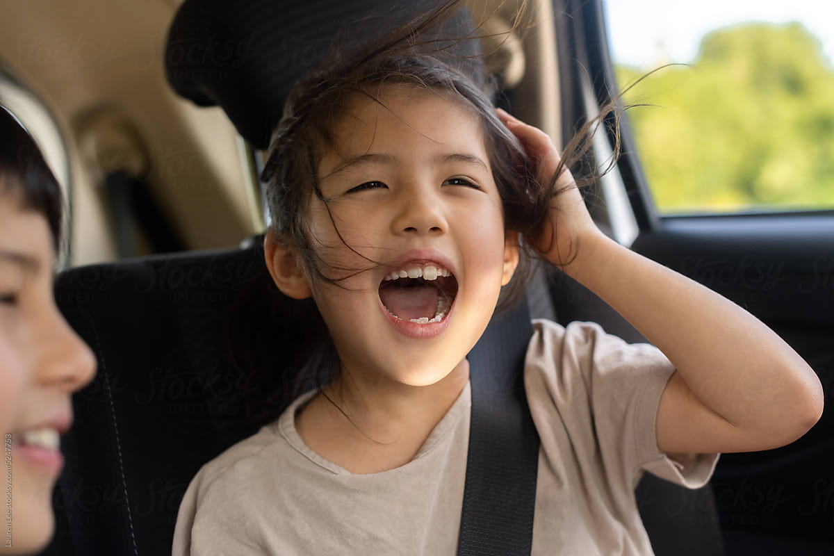 Happy kids singing in the car