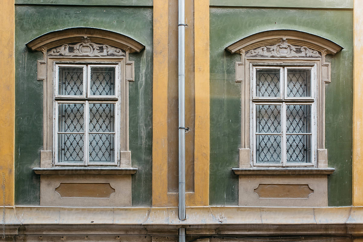 Pair of windows on an old building in Timisoara, Romania