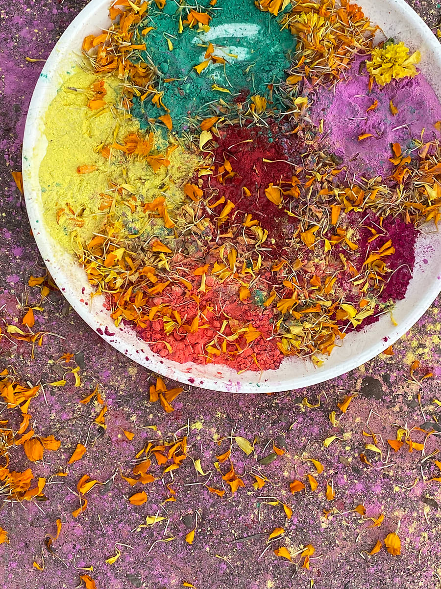 Colorful powder and yellow colored pallets in holi