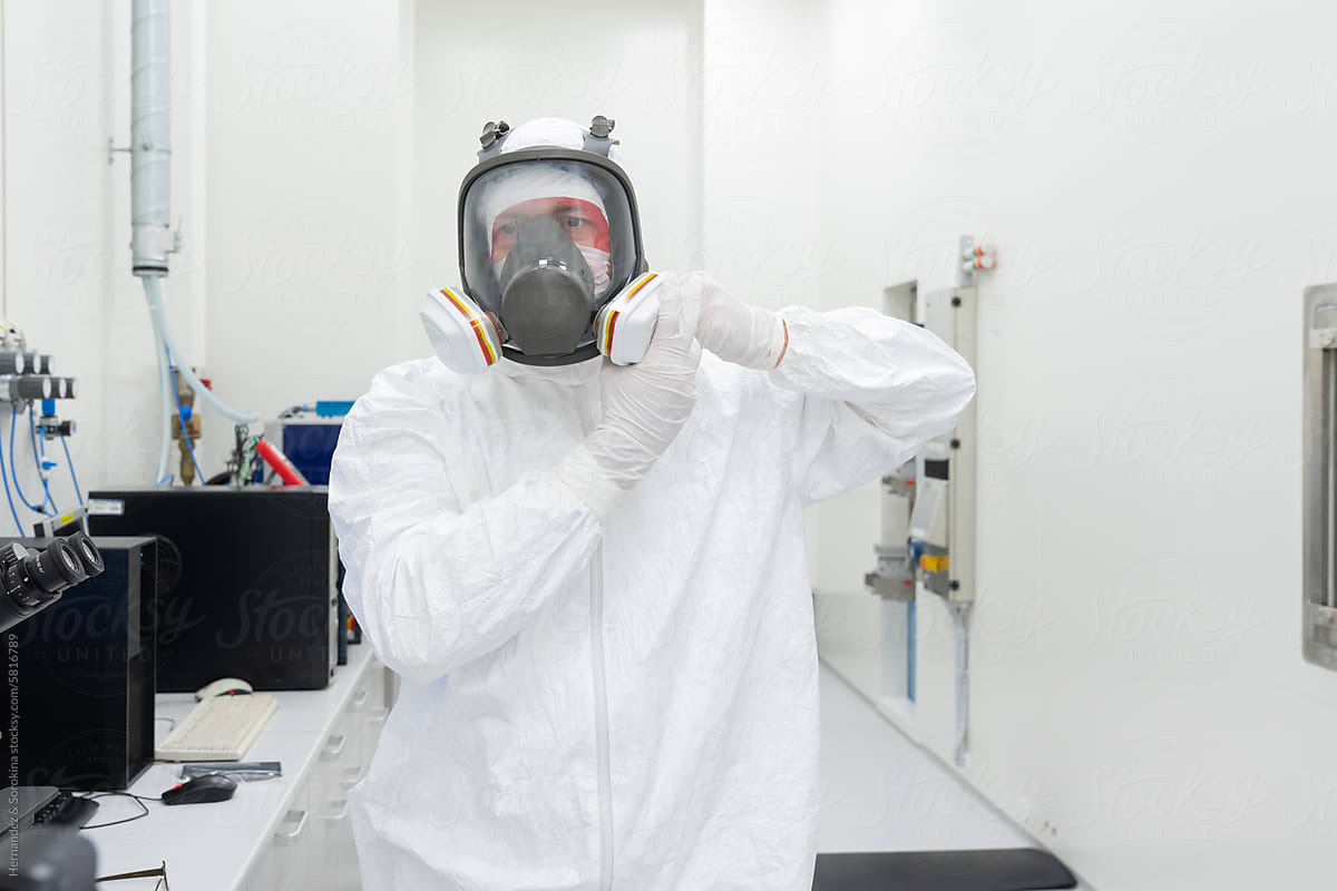Researcher Putting Helmet At Clean Room