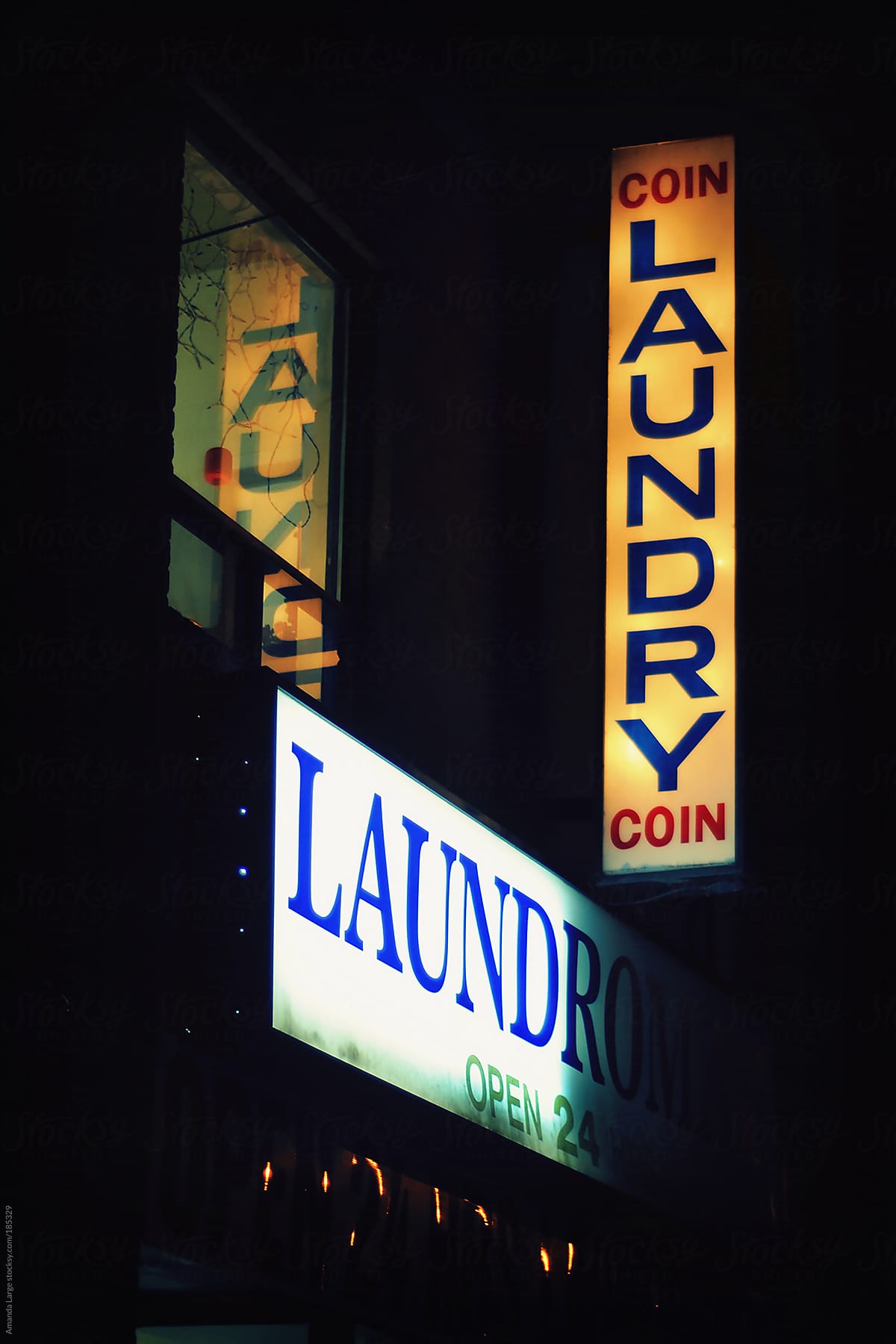coin laundry sign lit up at night