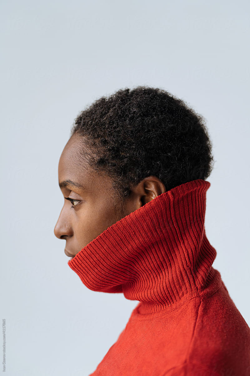 Black woman in stylish red turtleneck