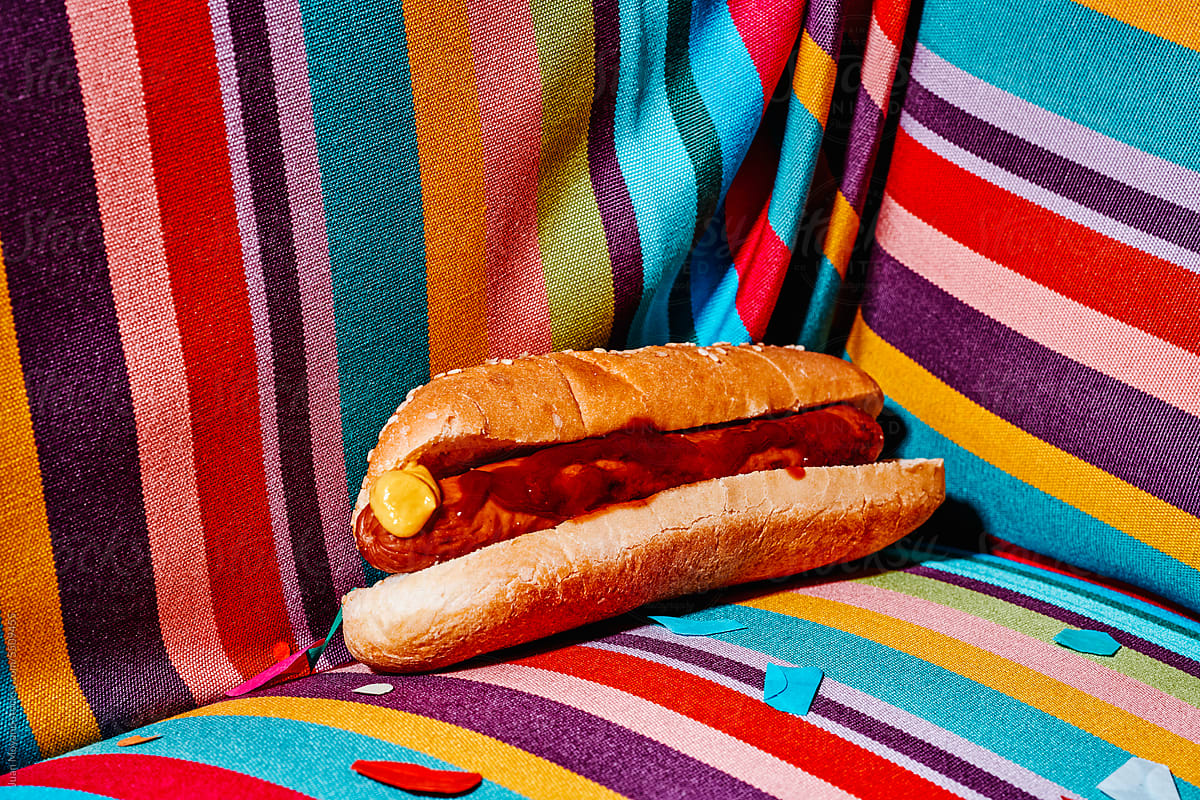 hotdog and confetti on an armchair