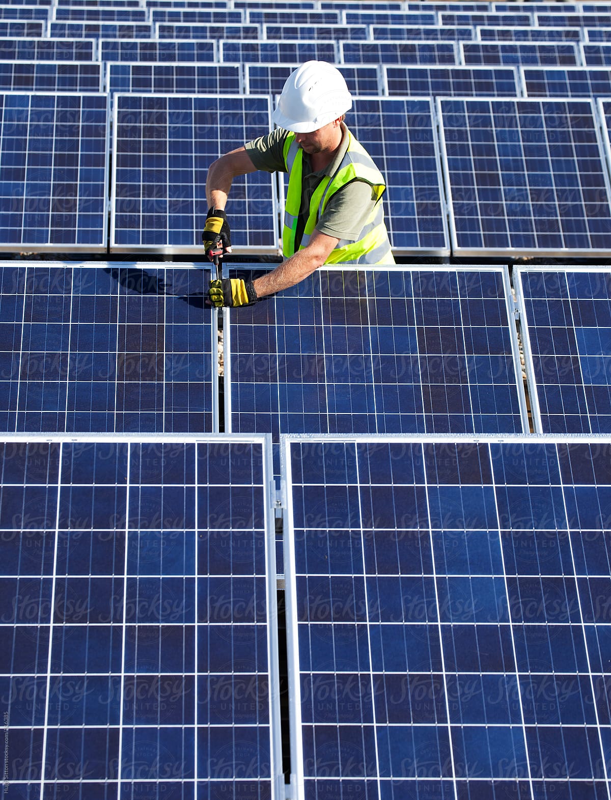 Technician working on solar panel
