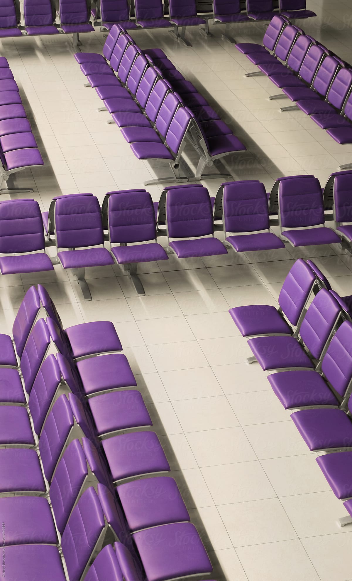 Empty purple chairs on airport