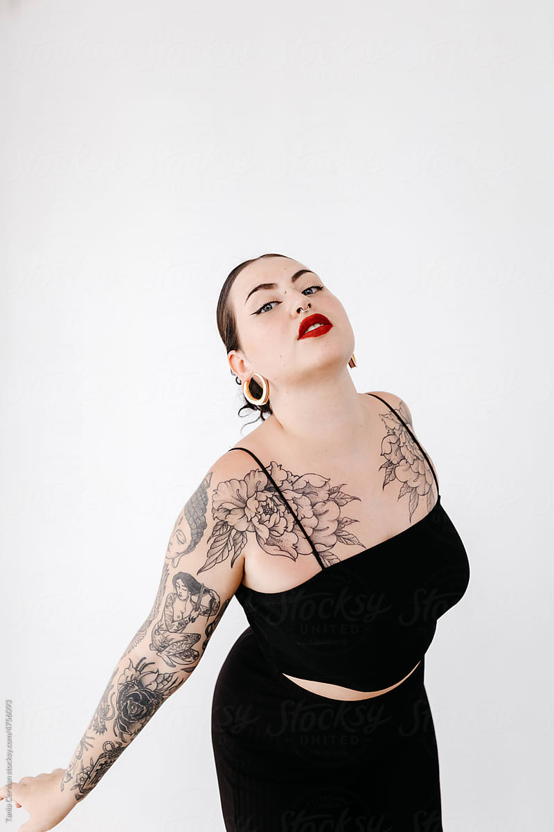 Tattooed woman in black wear