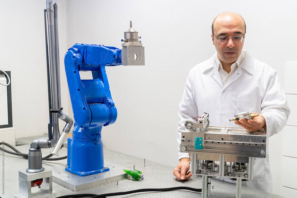 Scientist Working At Robotics Laboratory Room