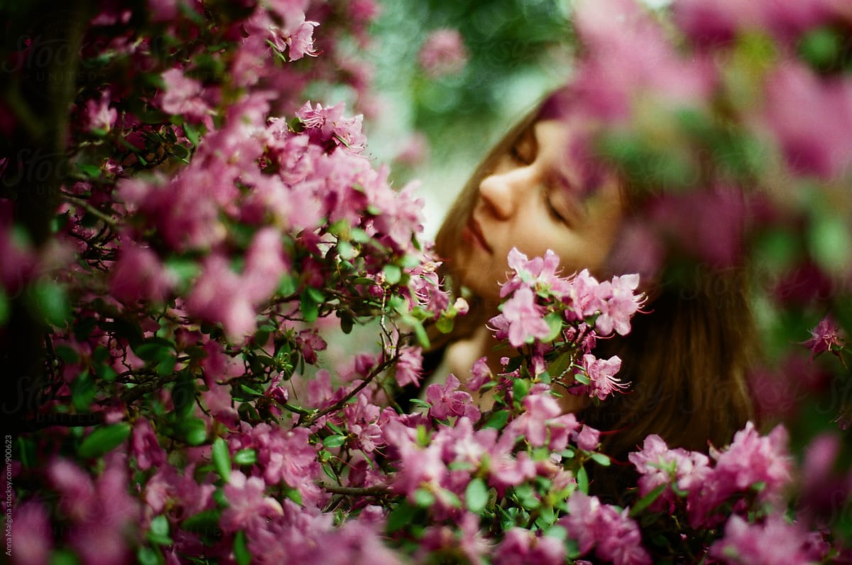 A beautiful woman in rose flowers