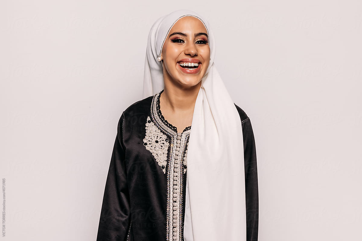 Portrait of happy woman in traditional Islamic apparel
