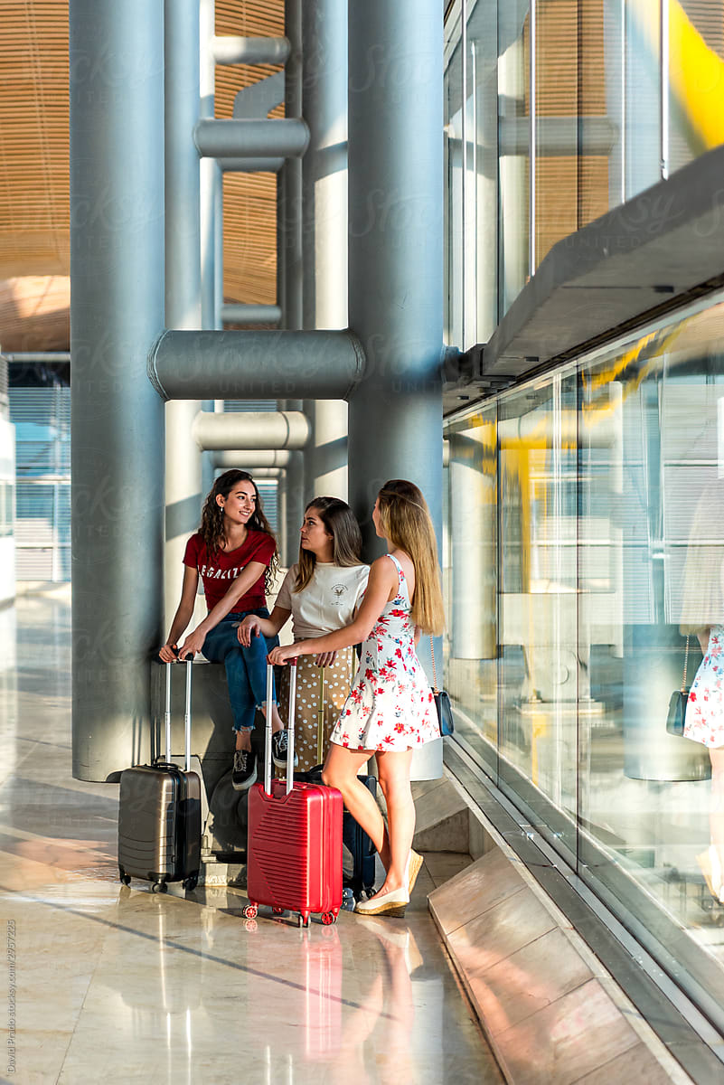 Female tourists chatting in airport