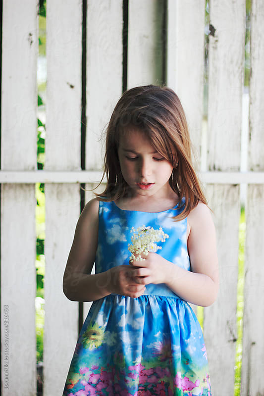 Adorable little girl holding little bouquet of flowers by Jovana Rikalo ...
