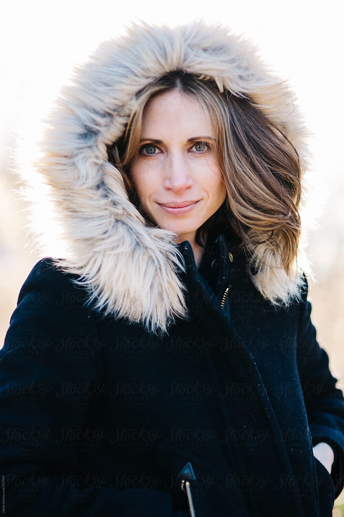 Portrait Of A Beautiful Woman With A Fur Trim Hood Over Her Head By Stocksy Contributor Jakob 