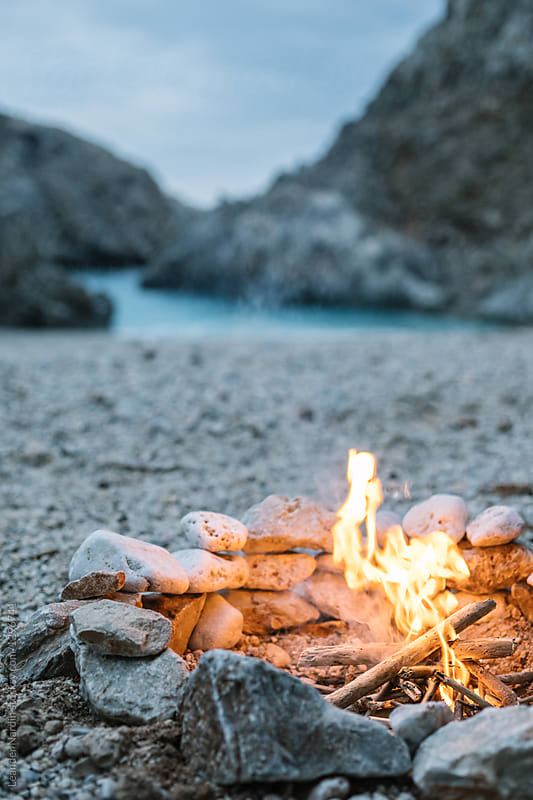 campfire between stones on a beautiful beach, greece, crete