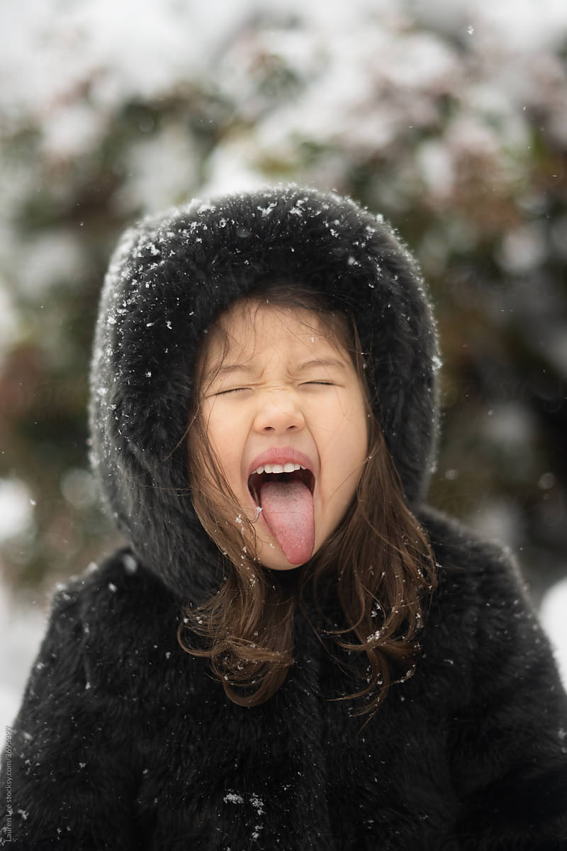 Child catching snow