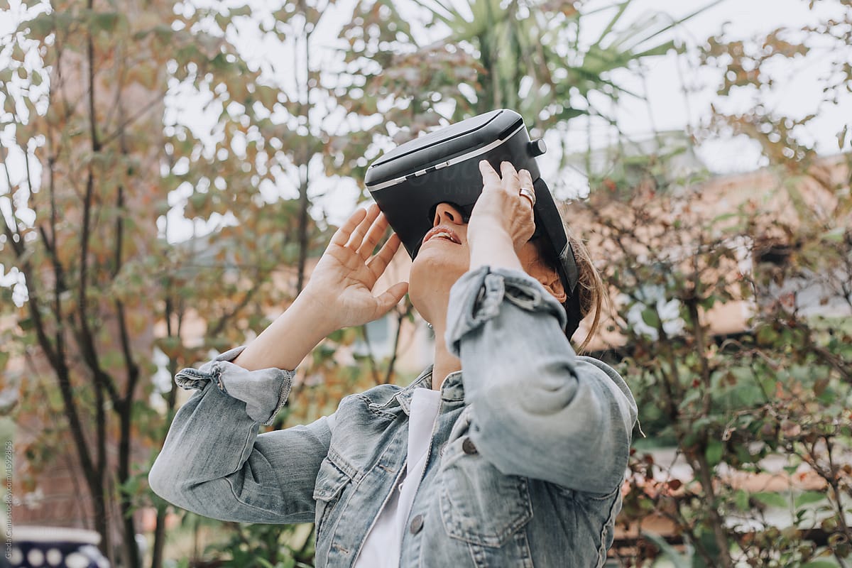a woman looking up with a VR goggles