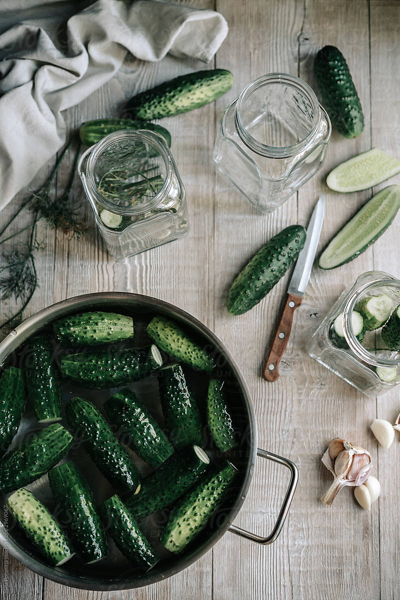 Canned cucumbers, garlic and glass jars.