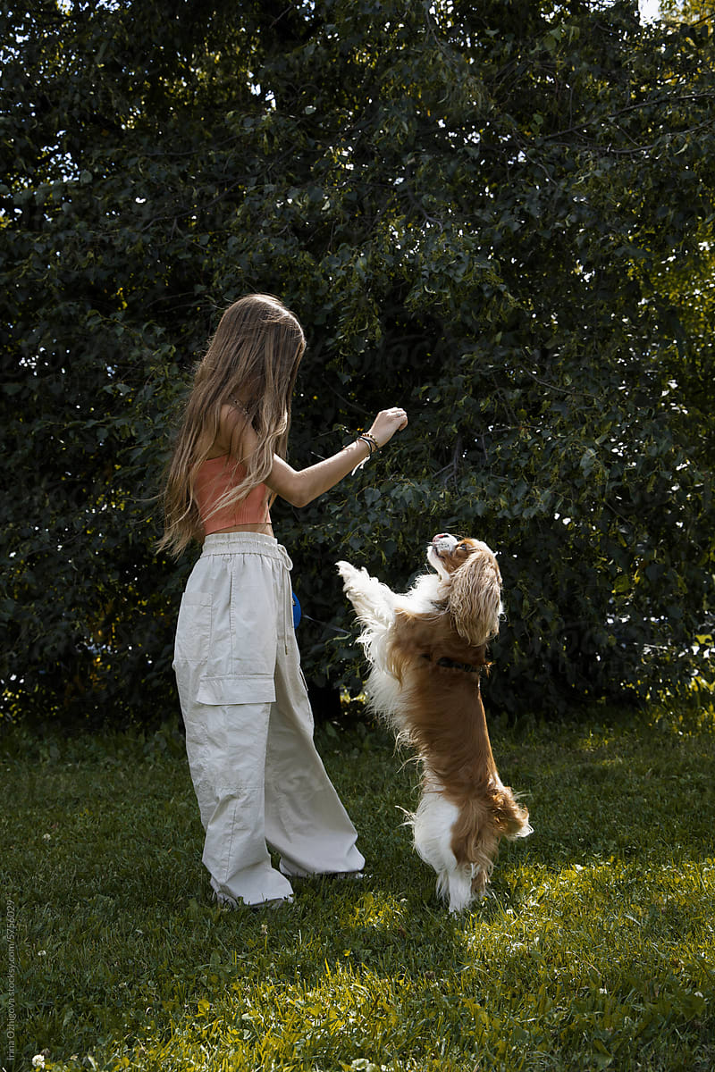 Girl with a dog outdoors