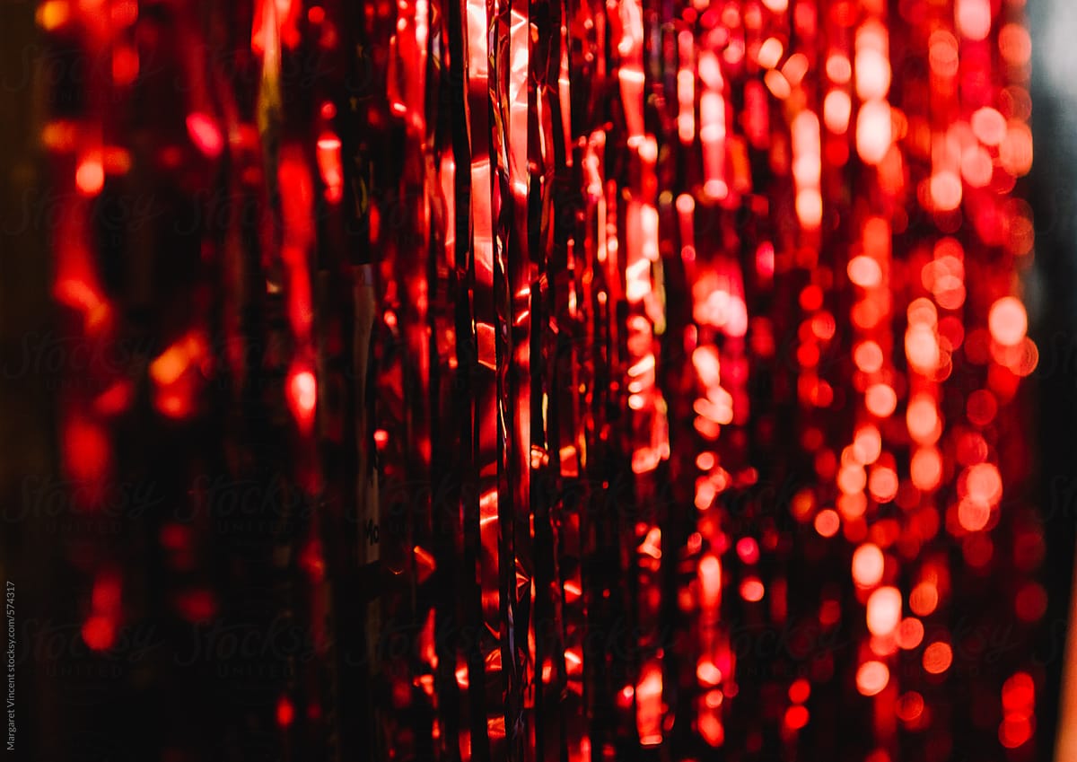 Shimmery Red Streamers, Horizontal by Stocksy Contributor Margaret  Vincent - Stocksy