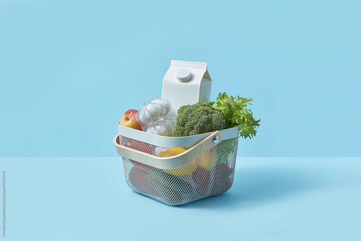 Fresh vegetables, milk and eggs in plastic box.