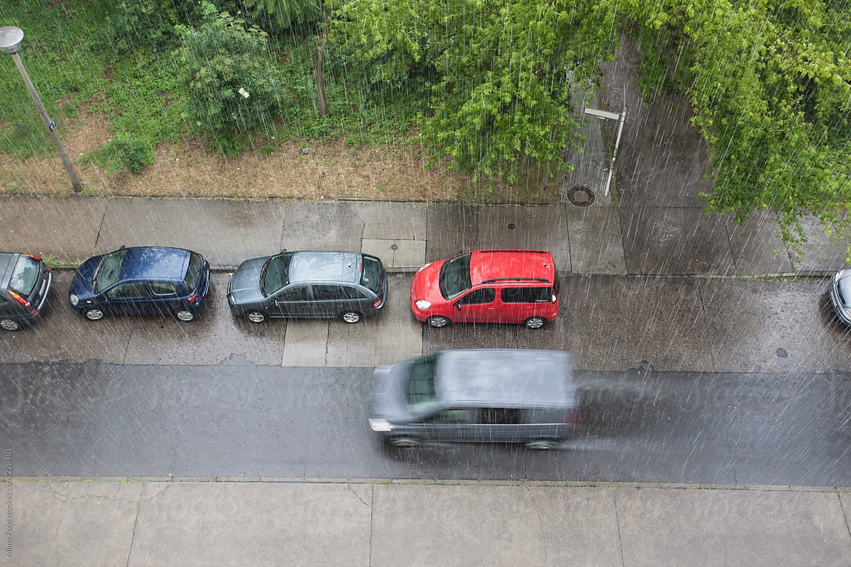 Rain pouring on street and cars