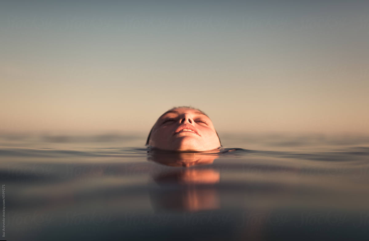 Woman enjoying a pleasant summertime bathe in the sea