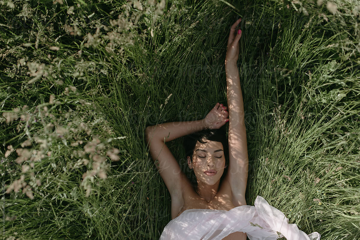 a woman lying on the grass