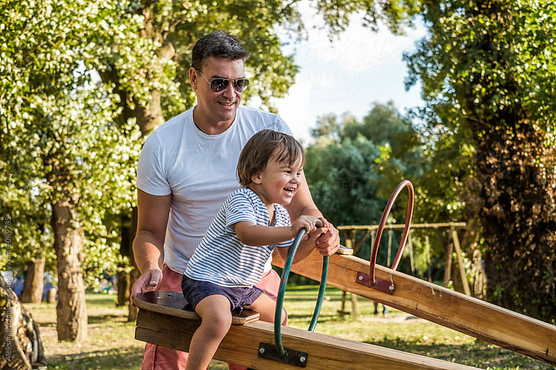 Dad and Son Playing at the Park