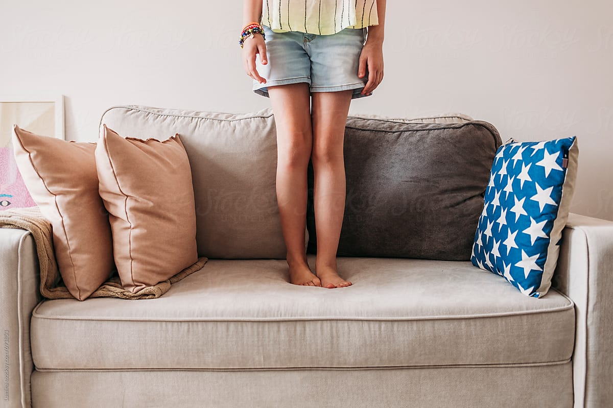 Girl Standing On A Sofa By Stocksy Contributor Lumina Stocksy