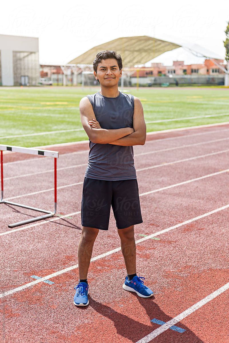 Portrait of a man dressed in sportswear posing in an athletic track