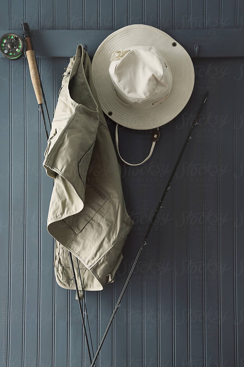 Fishing Hat And Equipment Hanging On Hooks by Stocksy Contributor Sandra  Cunningham - Stocksy