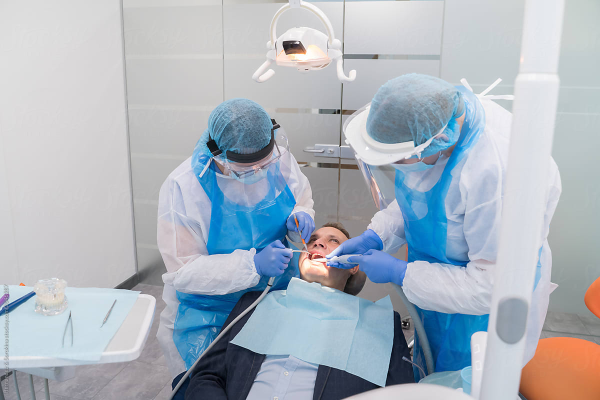 Dental Intervention With Protective Clothes