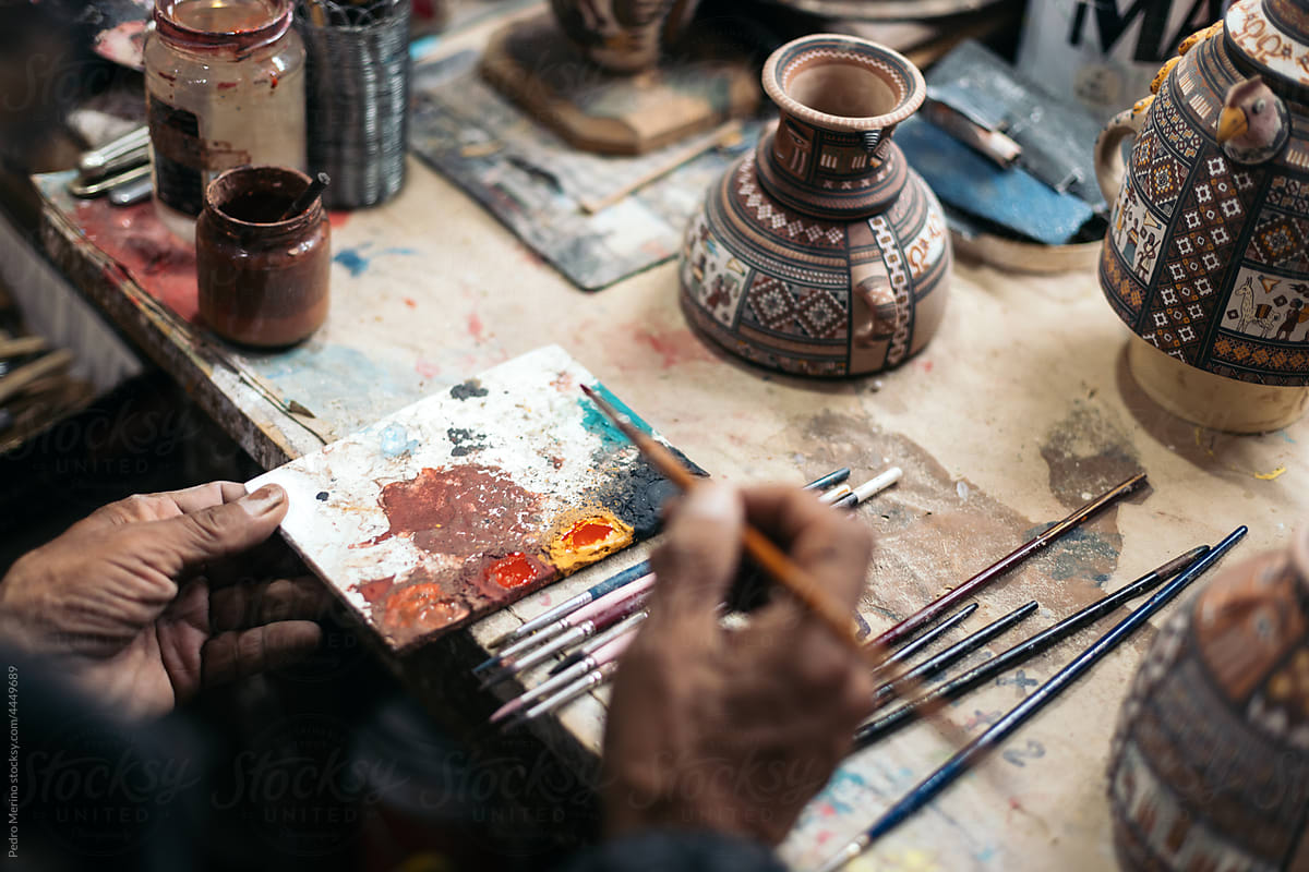 Ceramic artist working in his workshop
