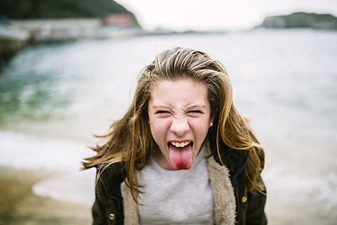 Three Teen Girls Showing Their Tongue To Camera by Stocksy Contributor  VICTOR TORRES - Stocksy