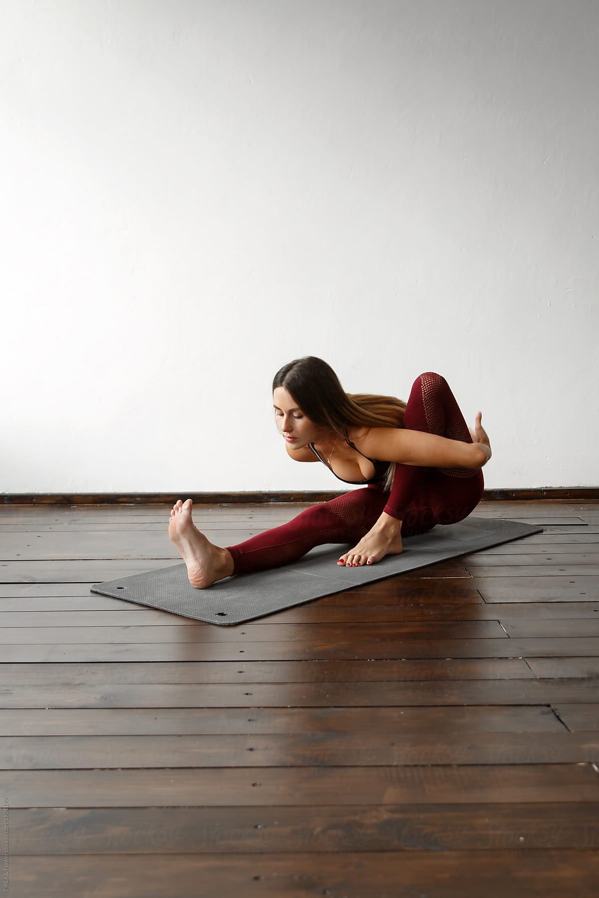 Flexible woman training yoga in peace