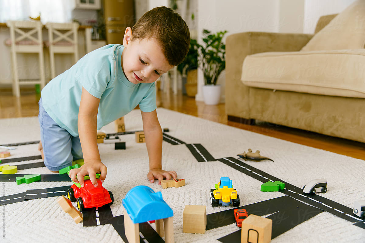 Little boy  playing and learning traffic at home