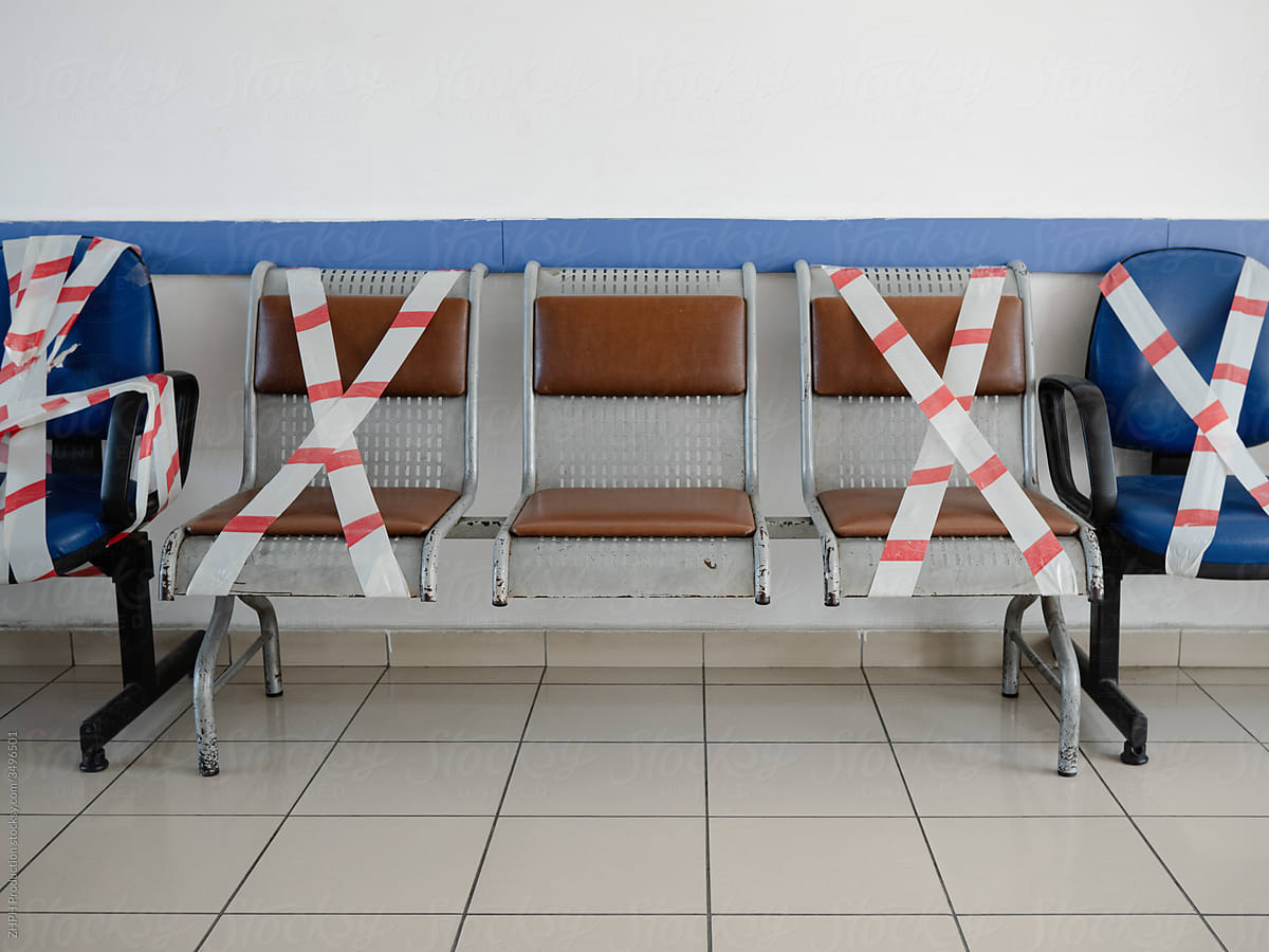 Chairs crossed with caution tape in times of pandemic