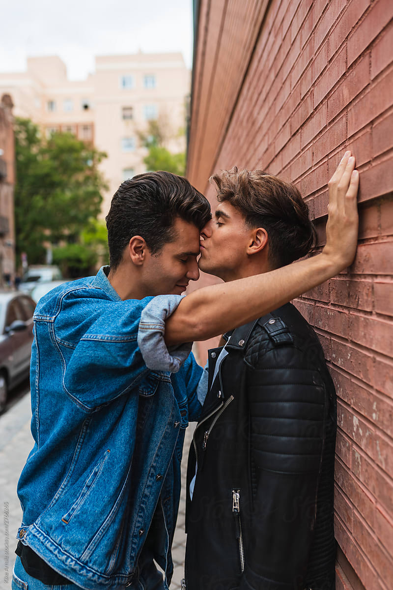 Gay couple kissing forehead