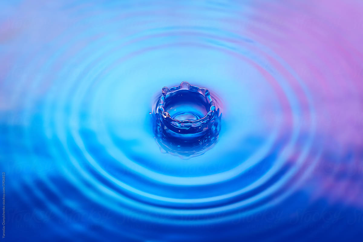 Water splash with iridescent gradient in blue and pink tones