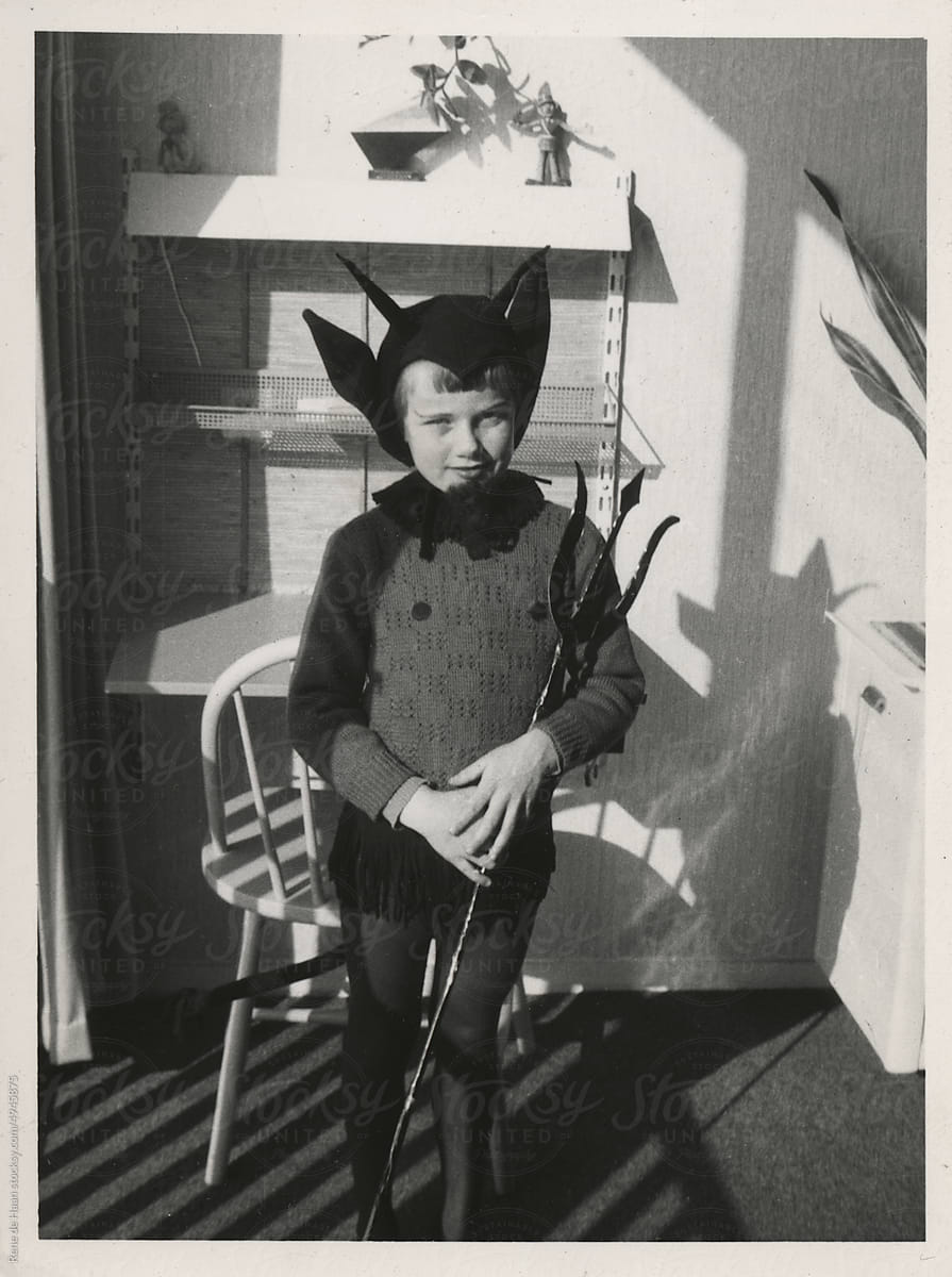young girl dressed up in devil costume