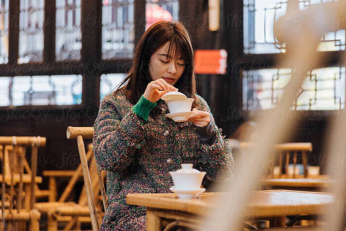 Woman drinking traditional Chinese tea