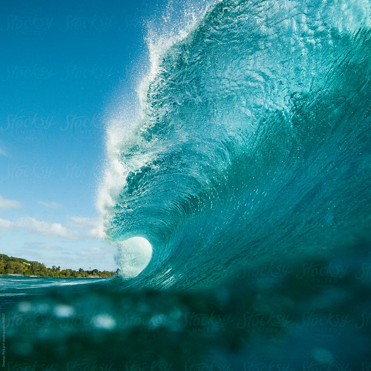 Wave breaking over reef, Cook Islands.