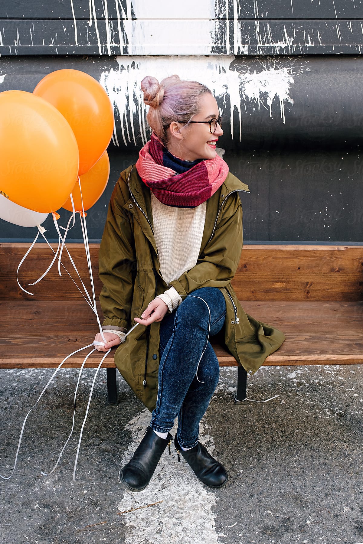 Teen Girl Sitting On Bench With Balloons By Stocksy Contributor